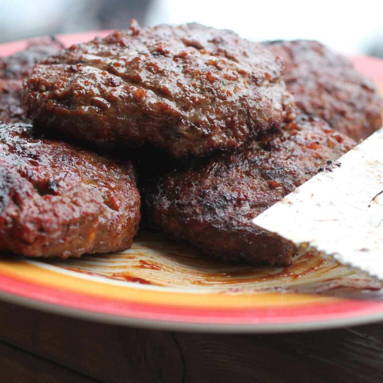 The Best BBQ Burgers on a Plate with a Spatula