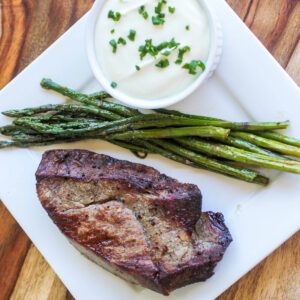 Broiled Steak and Asparagus with Feta Cream Sauce