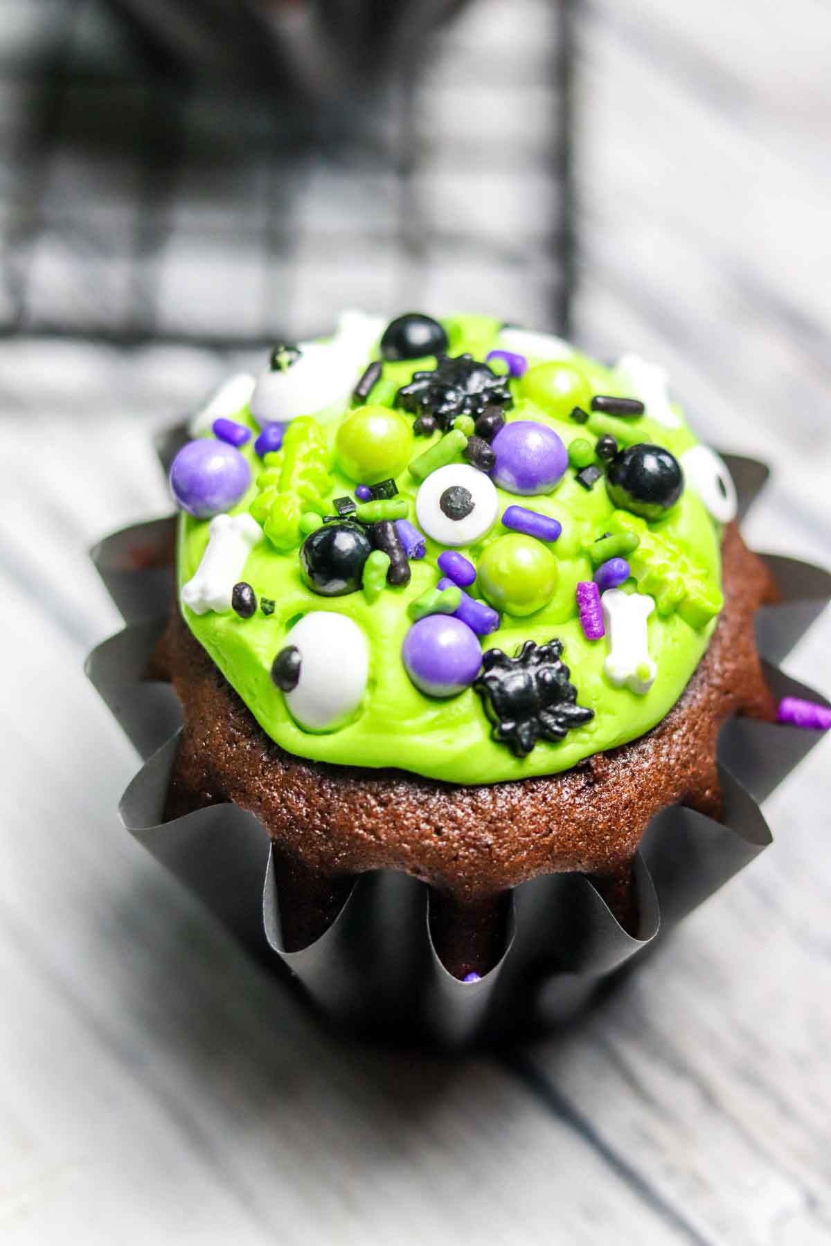 Close up of Chocolate Caramel Filled Cupcakes decorated for halloween.