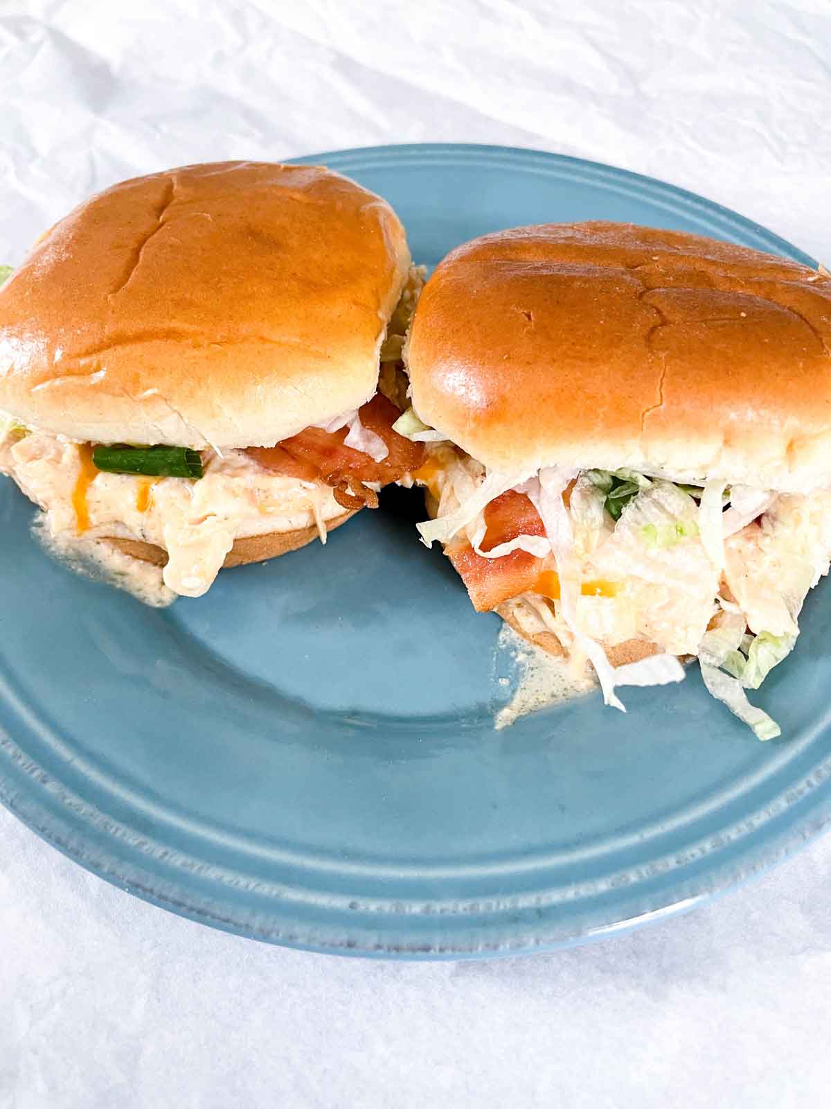 Creamy Crack Chicken Sliders on a Blue Plate