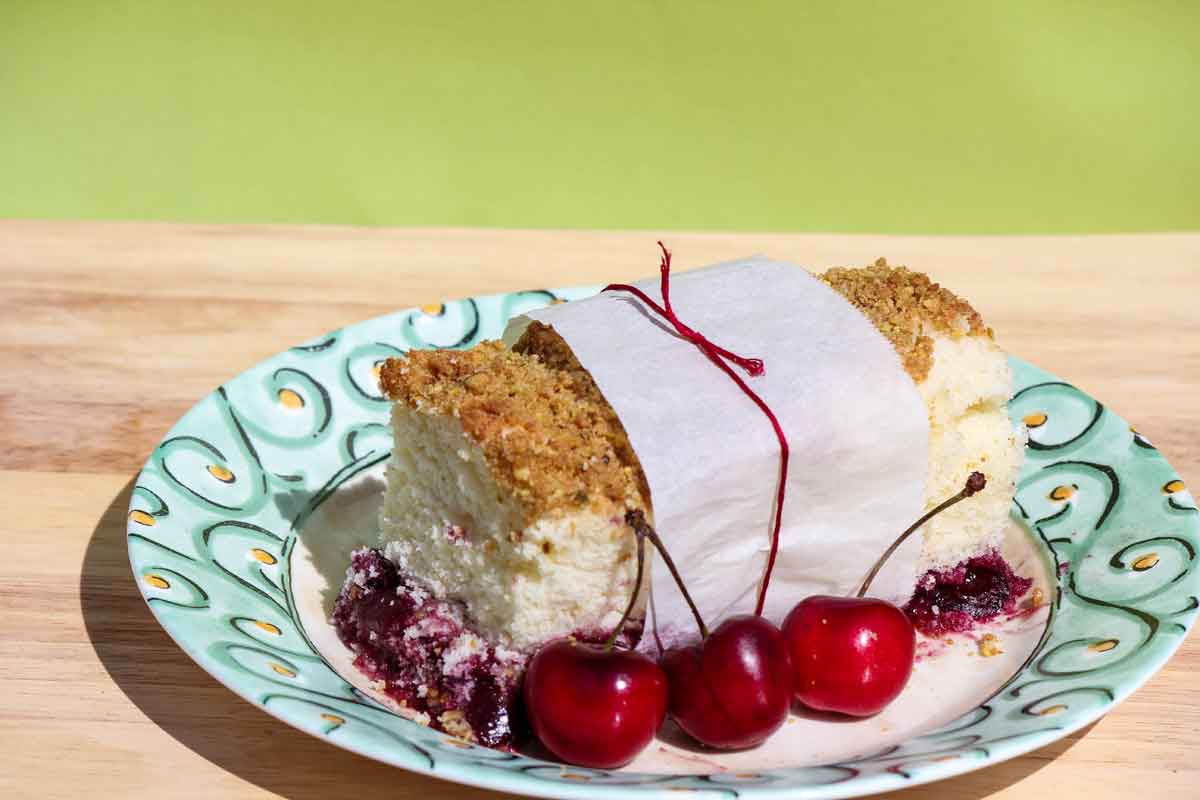 Cherry Crumb Cake on a Plate with cherries