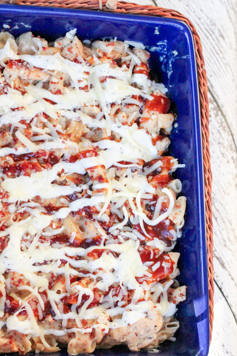 Ranch BBQ Cheesy Skillet Dinner in a blue casserole dish on a white wood surface